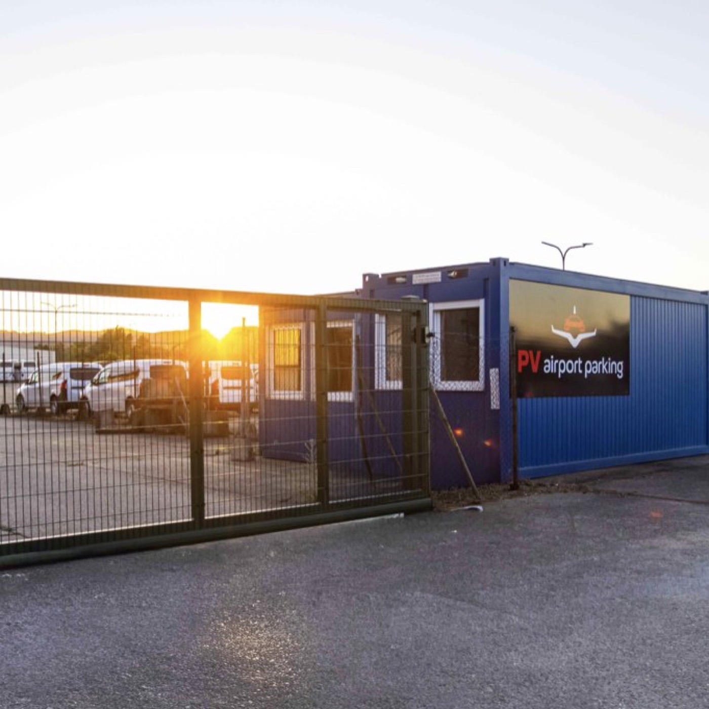 The closed PV airport parking car park with its gate at sunset